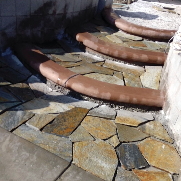 Curved flagstone walkway through garden Hardscaping Services